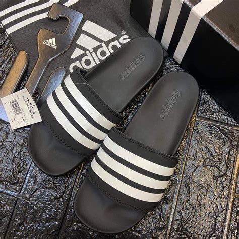 fake adidas slippers|are adidas shoes false.